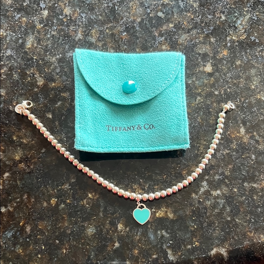 Auth Tiffany & Co. Silver Bead Bracelet with blue Heart Charm. 7.5 inches